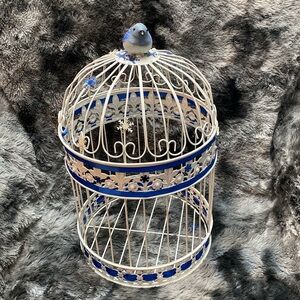 White  Wrought Iron Birdcage
Decorative Hinged Bird Embellished with blue bird
